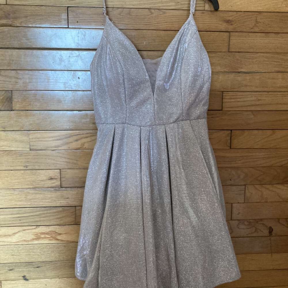 Prom dress, only worn once.Glittery pinkish, size 9/10. The brand is B. darlin